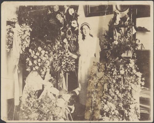 Elizabeth Haynes surrounded by flowers, Sydney, approximately 1933