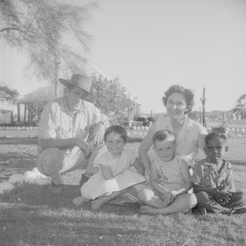 Rod, Edna, Meldie and Tommy Quilty with an Aboriginal child Johnny Ray, Bedford Downs Station, via Halls Creek, Kimberleys, Western Australia, 1958 [picture] / Frank H. Johnston
