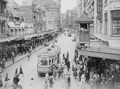 Street scene with trams and a signal control box, Sydney, ca. 1935 [picture] / E.W. Searle