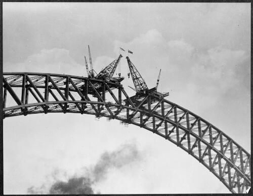 Lower chord connected during construction of the arch of the Sydney Harbour Bridge, Sydney Harbour, 1930, 2 [picture] / E.W. Searle