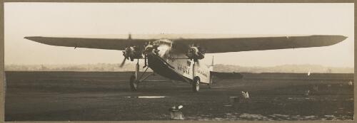 Faith in Australia, VH-UXX, an Avro 618 Ten Modified, owned by Charles Ulm, taxiing, Australia, ca. 1934 [picture] / E.W. Searle