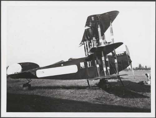 Side view of an Avro 547 triplane with its tail skid placed on a barrel, Australia, ca. 1921 [picture] / E.W. Searle
