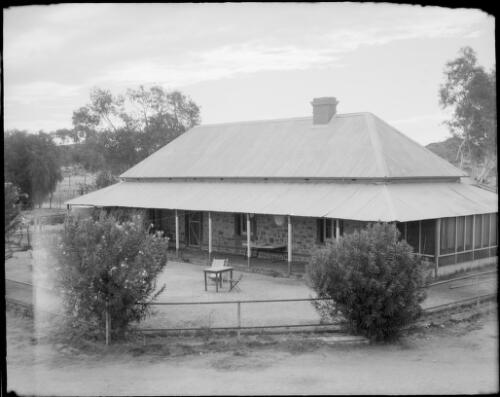 Building with a verandah, a table and two chairs outside, Northern Territory, 1947 [picture] / E.W. Searle
