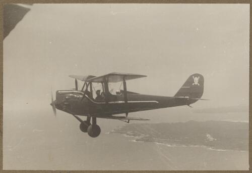 Henry Goya's General Aircraft Genairco, VH-UOG, in flight, Temora, New South Wales, ca. 1936 [picture] / E.W. Searle