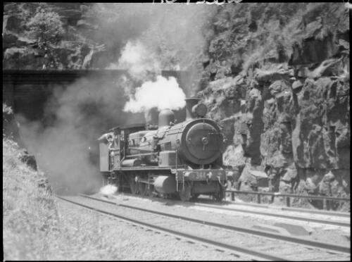 Locomotive emerging from a tunnel, near Brooklyn, Hawkesbury River region, New South Wales, ca. 1935 [picture] / E.W. Searle