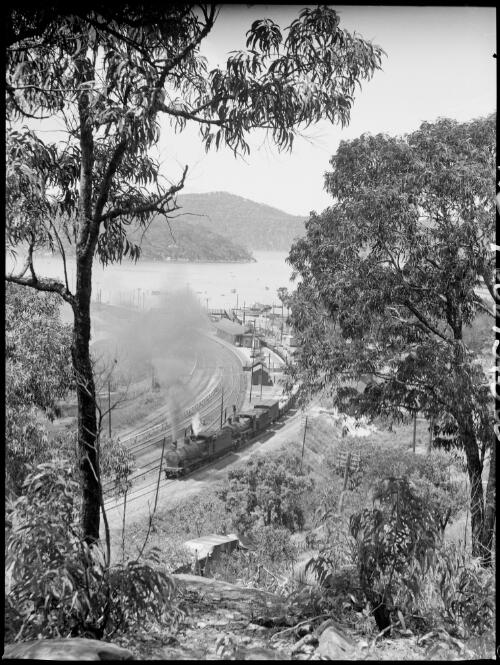 Double headed goods train leaving Hawkesbury Station, Brooklyn, Hawkesbury River region, New South Wales, ca. 1935 [picture] / E.W. Searle