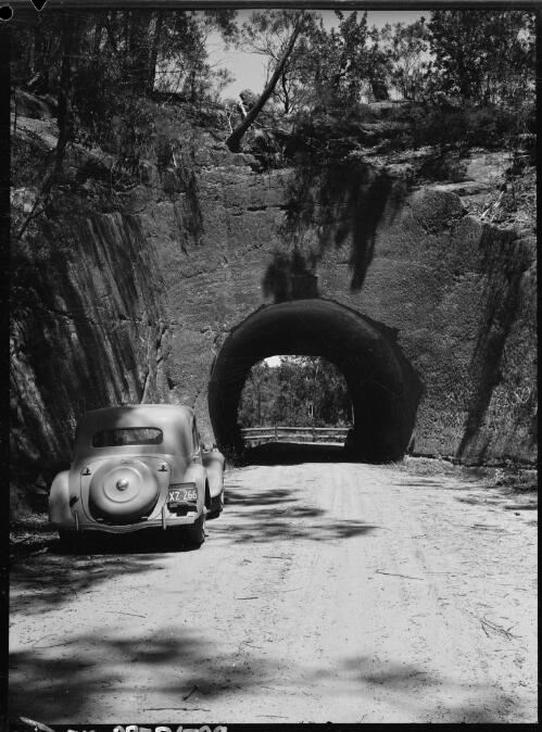 E.W. Searle's Citroen stopped by a tunnel on the Wombeyan Caves Road, near Mittagong, New South Wales, ca. 1950, 1 [picture] / E.W. Searle