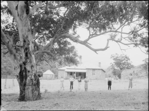 Six people standing outside a house, Australia, ca. 1945, 1 [picture] / E.W. Searle