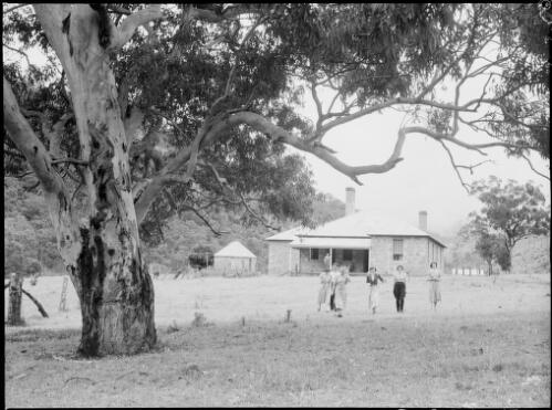 Six people standing outside a house, Australia, ca. 1945, 2 [picture] / E.W. Searle