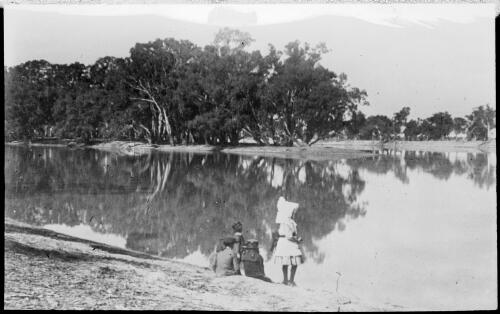 Two women and two girls beside a creek, Australia, ca. 1900 [picture] / E.W. Searle