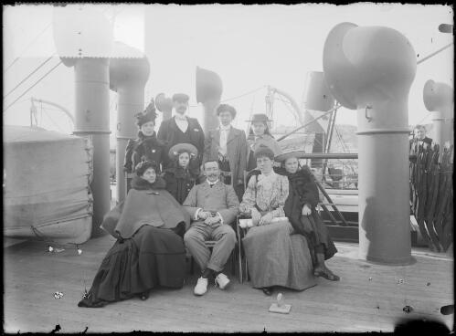 Group of men, women and two children on board a ship, Australia, ca. 1900 [picture] / E.W. Searle