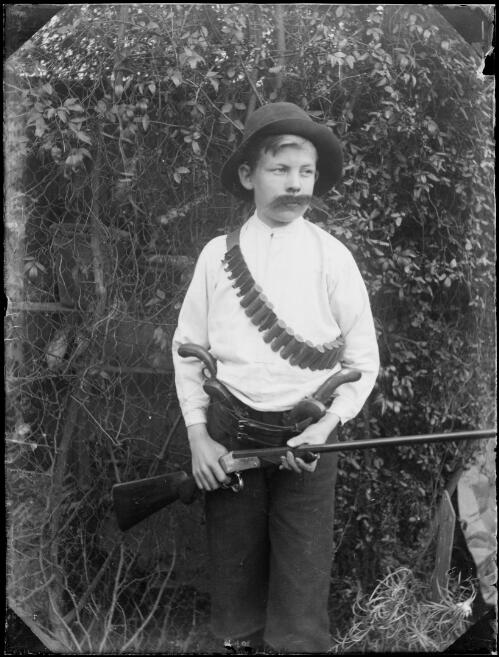Boy holding a rifle, Australia, ca. 1900 [picture]