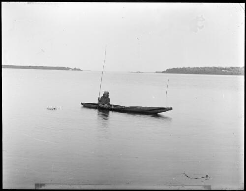 Indigenous woman seated in a dugout canoe, Lake Tyers, Victoria, ca 1900 [picture]