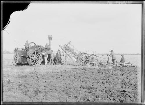 Men working in a field with a steam traction engine, Gippsland, Victoria, ca. 1900 [picture]