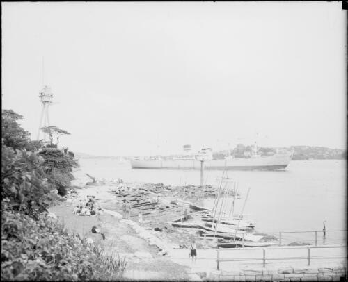 Harbour control tower, sailing boats by the waters edge and the SS Hoegh Silvercloud, Sydney Harbour, ca. 1947 [picture] / E.W. Searle