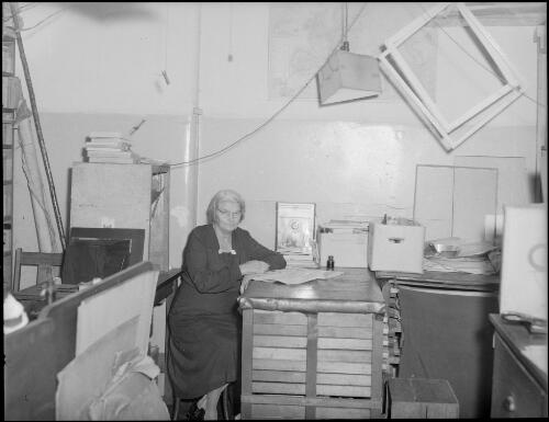 Mrs Searle in the processing area of E.W. Searle's photographic studio, Grace Brothers Store, Grose Street, Broadway, Sydney, ca. 1948 [picture] / E.W. Searle