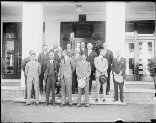 Group of men in an internal courtyard of old Parliament House, Canberra, ca. 1927, 1 [picture] / E.W. Searle