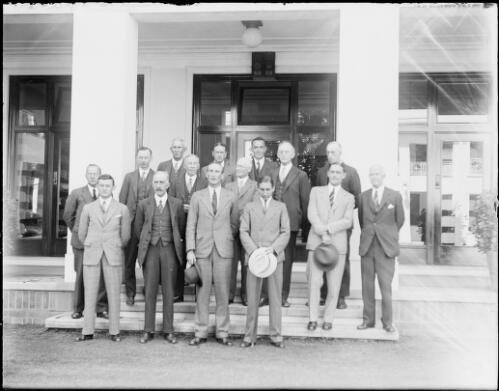 Group of men in an internal courtyard of old Parliament House, Canberra, ca. 1927, 2 [picture] / E.W. Searle