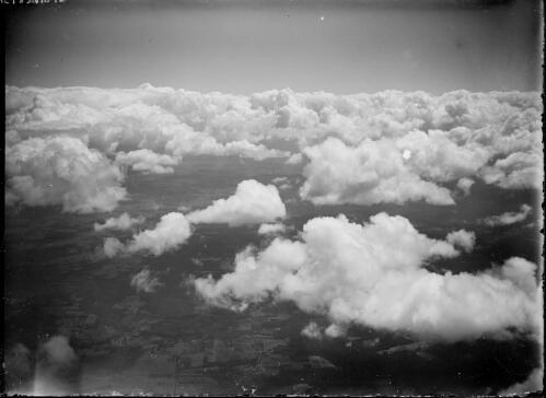 High altitude aerial view of clouds and agricultural land, New South Wales, ca. 1945, 1 [picture] / E.W. Searle