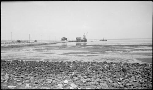 Pier and two moored boats, Kurnell, Botany Bay, New South Wales, ca. 1935 [picture] / E.W. Searle