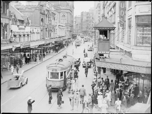 Street scene with trams and a signal control box, Sydney, ca. 1935, 1 [picture] / E.W. Searle