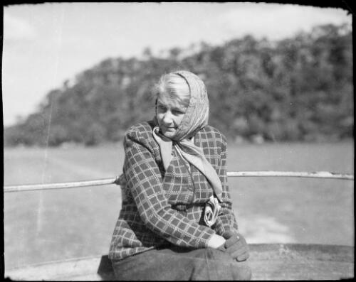 Mrs Searle wearing a headscarf, Oxford Falls, New South Wales, ca. 1945 [picture] / E.W. Searle