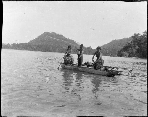 Three women in an outrigger canoe, Fiji, ca. 1920 [picture] / E.W. Searle