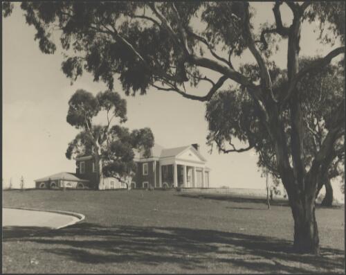 Looking up a slope towards the Embassy of the United States of America, Canberra, ca. 1949 [picture] / E.W. Searle