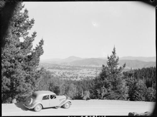View of Canberra from Mount Stromlo Road, with the Searle's Citroen in the foreground, Canberra, ca. 1949 [picture] / E.W. Searle