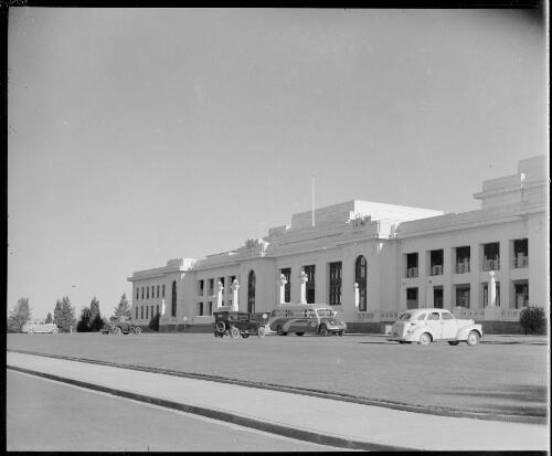 Front of old Parliament House with a bus and parked cars, Canberra, ca. 1949 [picture] / E.W. Searle