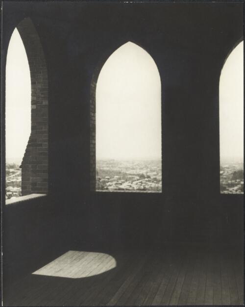 View over the city through arched openings, Stuartholme School, Toowong, Queensland, ca. 1949 [picture] / E.W. Searle