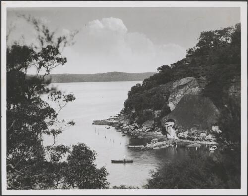 Boats around a stone jetty, Hawkesbury River, New South Wales, ca. 1935 [picture] / E.W. Searle