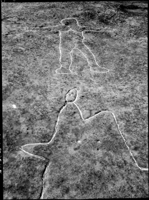Rock carving of a unidentified shape and a human form, Sydney region, ca. 1950 [picture] / E.W. Searle