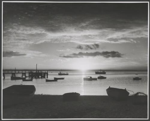Beached and moored boats at sunset, Manly Cove, Sydney Harbour, ca. 1939 [picture] / E.W. Searle