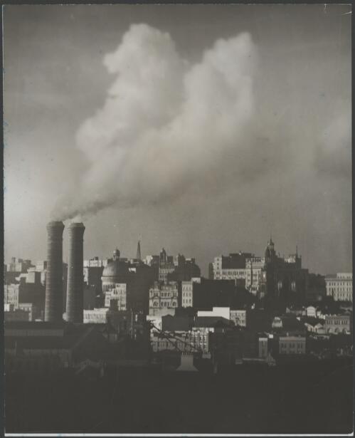 City skyline with the chimney stacks of Ultimo Power Station, Sydney, ca. 1935, 1 [picture] / E.W. Searle