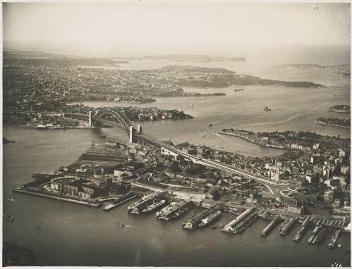 Aerial view of the Sydney Harbour Bridge with Miller's Point in the foreground, Sydney Harbour, ca. 1935, 1 [picture] / E.W. Searle