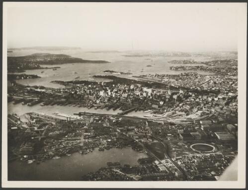 Eastern aerial view of Pyrmont, the city and the harbour, Sydney, ca. 1935 [picture] / E.W. Searle