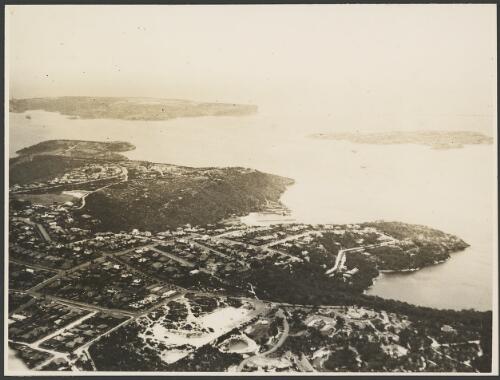 Aerial view North and South Heads with Clifton Gardens in the foreground, Sydney Harbour, ca. 1935 [picture] / E.W. Searle