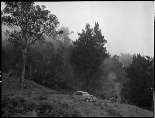 E.W. Searle's car stopped beside a road near Barrallier Crossing, Wollondilly River, New South Wales, ca. 1945 [picture] / E.W. Searle
