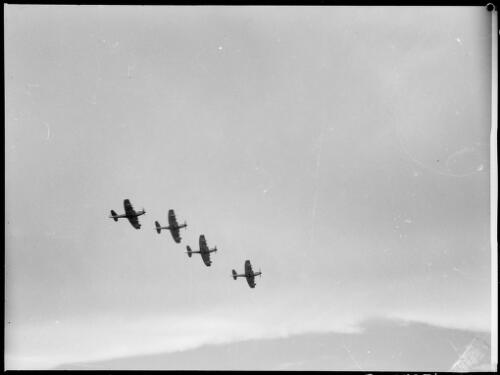 Four airforce aircraft flying overhead, Australia, ca. 1940 [picture] / E.W. Searle
