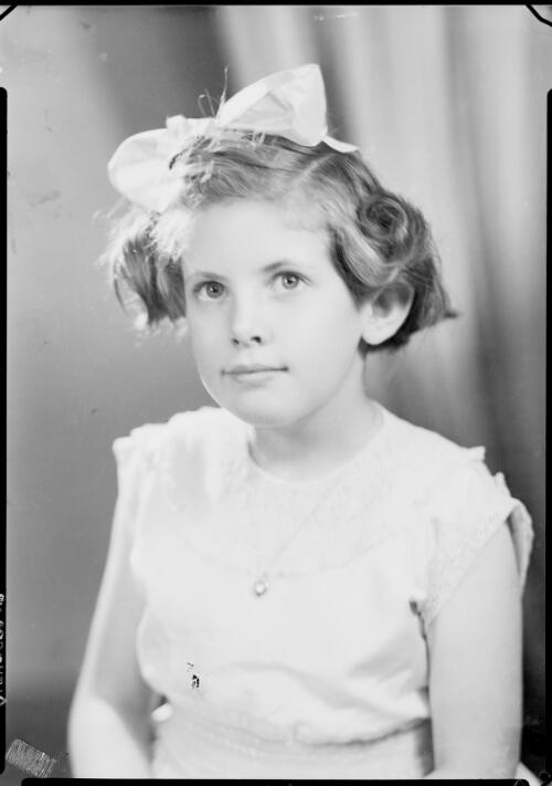 Portrait of a young girl with a ribbon in her hair, Australia , ca. 1945, 1 [picture] / E.W. Searle