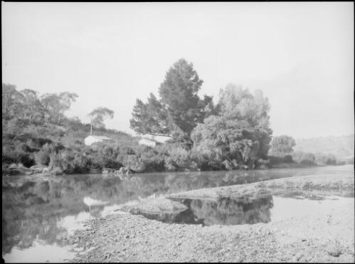 Huts on a river bank, Australia, ca. 1945, 2 [picture] / E.W. Searle