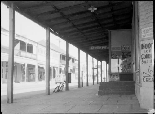 Street scene viewed from covered shop front, Australia, ca. 1945, 2 [picture] / E.W. Searle
