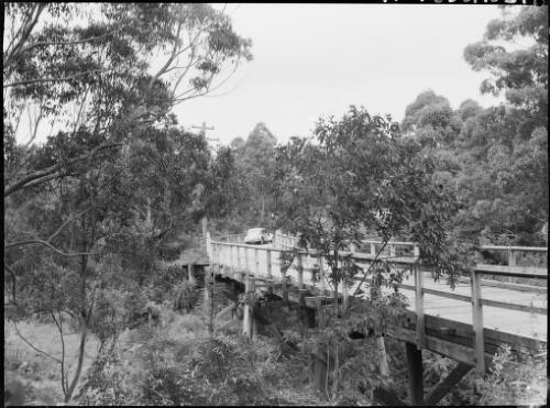 E.W. Searle's Citroen crossing a wooden bridge, Australia, ca. 1945 [picture] / E.W. Searle