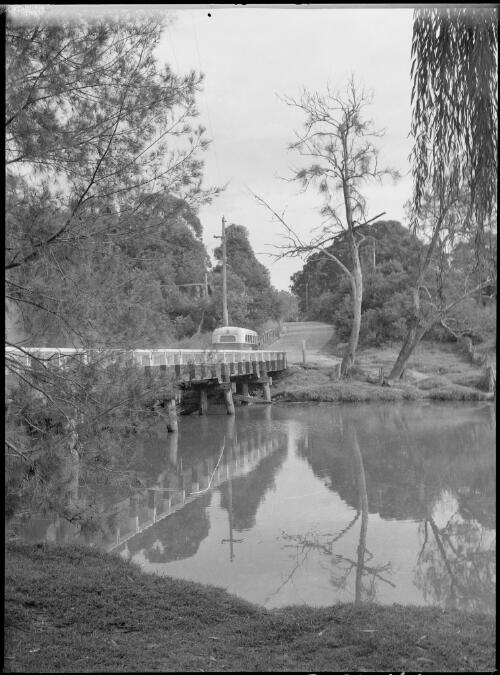 Bus crossing a wooden bridge, Australia, ca. 1945 [picture] / E.W. Searle