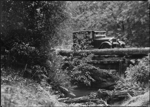 E.W. Searle's Erskine parked on a log bridge, New South Wales, ca. 1930 [picture] / E.W. Searle