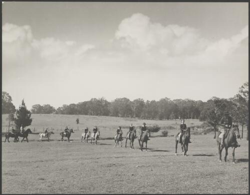 People on horseback at a riding school, Australia, ca. 1945 [picture] / E.W. Searle