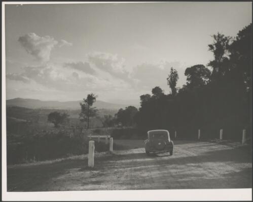 E.W. Searle's Citroen passing along a gently sloping road, Australia, ca. 1945 [picture] / E.W. Searle