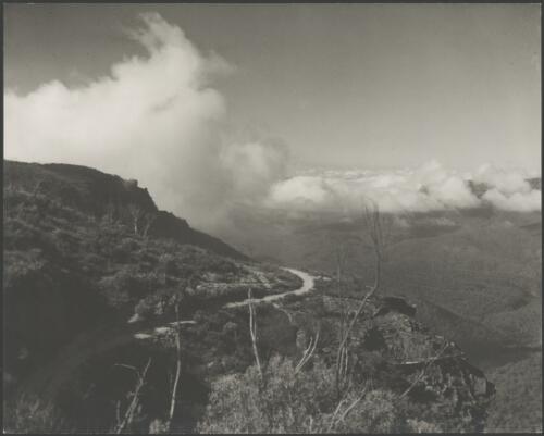 Dirt road winding around the side of a mountain, Australia, ca. 1935 [picture] / E.W. Searle
