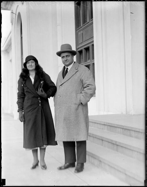 Mr and Mrs Stevens standing outside a building, Australia, 1932 [picture] / E.W. Searle